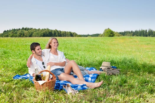 Picnic - Romantic happy couple in meadows nature sunny day