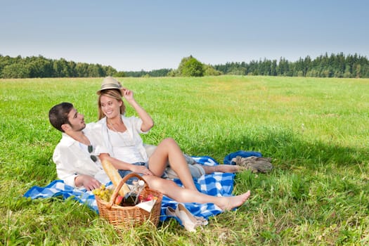 Picnic - Romantic happy couple in meadows nature sunny day