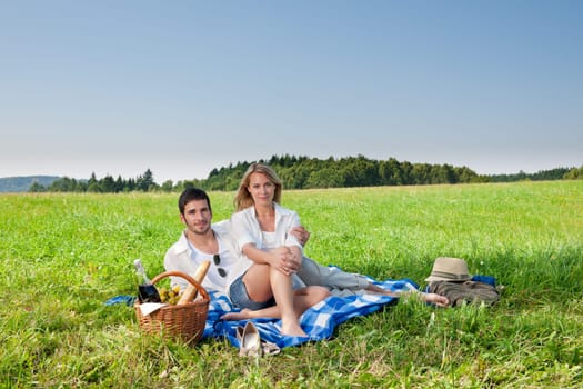 Picnic - Romantic happy couple in meadows nature sunny day