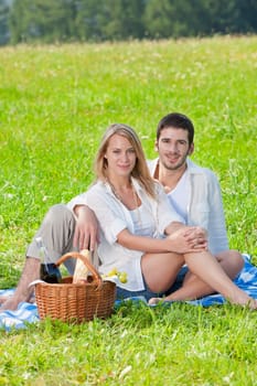 Picnic - Romantic happy couple in meadows nature sunny day