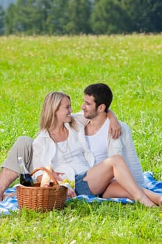 Picnic - Romantic happy couple in meadows nature sunny day