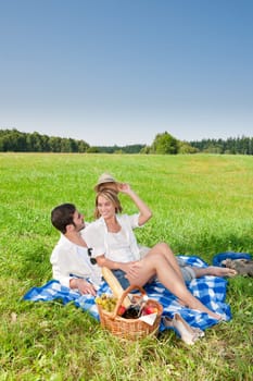 Picnic - Romantic happy couple in meadows nature sunny day