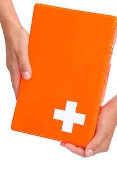 Hands of young woman holding first aid kit - isolated