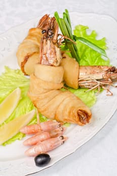 shrimps, with lettuce, green onion, lemon and black olive
