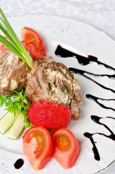 Pork rolls with cheese and vegetables: onion, cucumbers, tomatoes