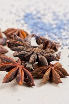 Anise stars close-up on a brown background
