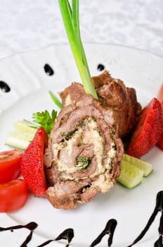 Pork rolls with cheese and vegetables: onion, cucumbers, tomatoes
