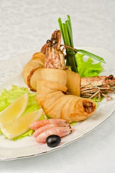 shrimps, with lettuce, green onion, lemon and black olive