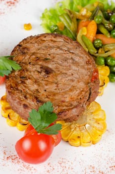 BBQ meat steak with vegetables and greens