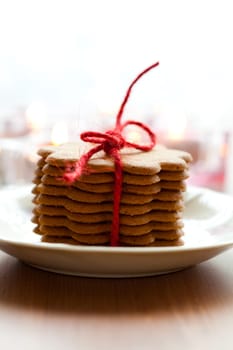 Close-up of delicious Christmas gingerbread cookies with candles