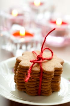 Close-up of delicious Christmas gingerbread cookies with candles