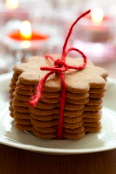 Close-up of delicious Christmas gingerbread cookies with candles