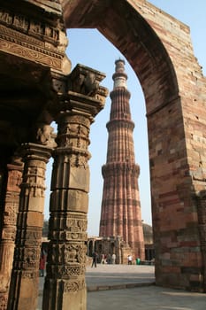 Qutb Minar framed in surrounding structure, Delhi, India, Asia