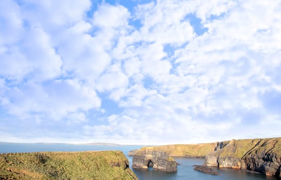 a view of the virgin rock in ballybunion ireland as seen from the cliffs on a calm winters day