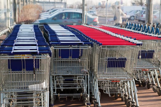 Row of empty shopping carts at the supermarket