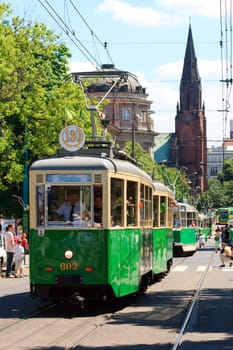 POZNAN, POLAND - JUNE 26, 2010 celebration of the 130th anniversary of MPK Poznan sp. z o.o. combined with a solemn parade of the vehicles. Both buses and tramways were put in ordered cue from the oldest to the newest starting from the horse tramway (1880