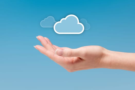 Cloud computing concept - connect to cloud is light as a feather. Hand with cloud icon.