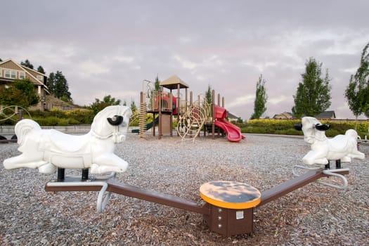 Neighborhood Public Park Children&#039 s Playground in Suburban Area with Seesaw
