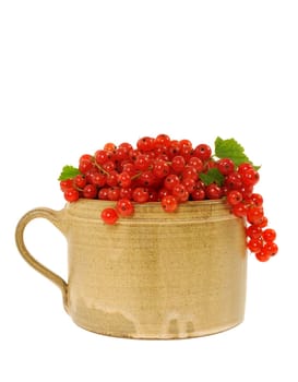 Ceramic cup full of fresh red currant berries. Clipping path included