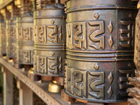 Tibetan prayer wheel,turning the roller with the right hand brings good karma