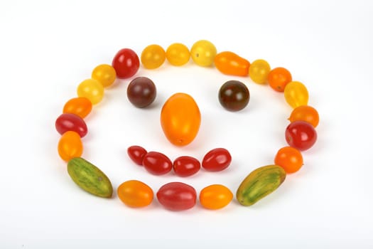 Smiley face laid from small organic tomatoes