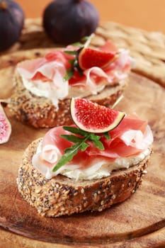 Sandwich with cream cheese, prosciutto, fig and rocket