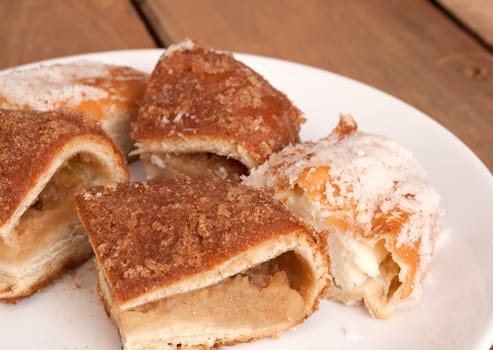 Sliced Apple Pie and Pie with Curds on Plate on Wooden Table