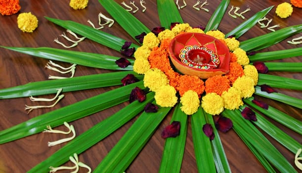 Rangoli, floral design display Hindu Festival by womenfolk a custom done outdoors or indoors during celebrations like Diwali and Holi, landscape, horizontal with crop margin