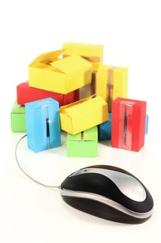 a computer mouse and packages against white background