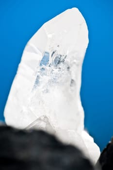 White Glowing Rock Crystal Quartz with Blue Background