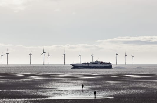 CROSBY BEACH, ENGLAND - SEPTEMBER 24: Steam Packet ferry sails into Liverpool on September 24, 2011. The 96-metre wave piercing catamaran is the largest vessel of its kind in the Irish Sea.