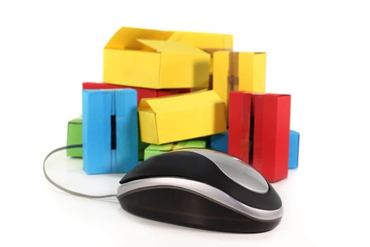 a computer mouse and packages against white background