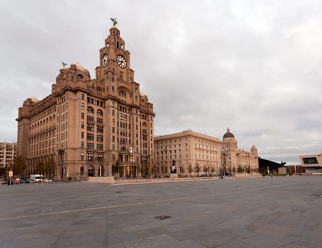 Three Graces and Liver building on waterfront in Liverpool, England