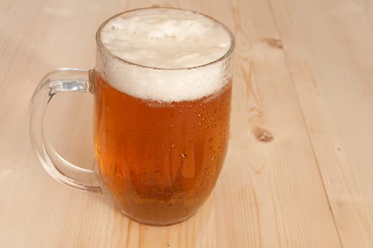 Glass Full of Beer on Wooden Table