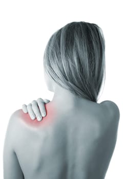 Woman pressing her hand against a painful shoulder