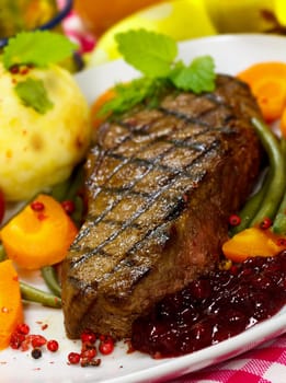 Rump steak with green beans,puree,carrots,cranberries