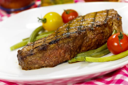 Rump steak with green beans,puree,carrots,cranberries