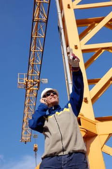 building-worker, engineer with large construction-crane in background