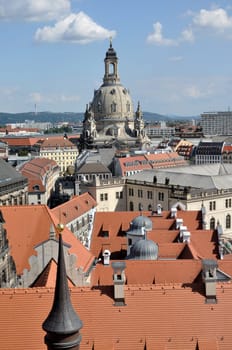 cityscape of center dresden with the dome of our lady church that stands over city roofs, the church has been completely rebuilt after second world war damages