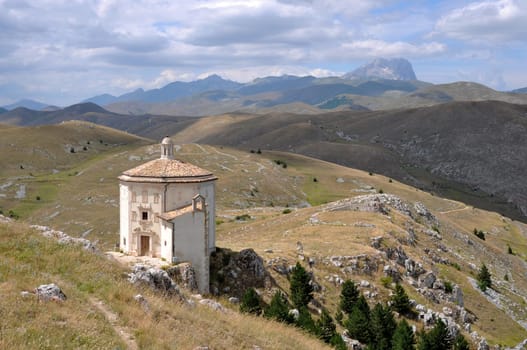 ancient church in barren landscape of apennines high mountains