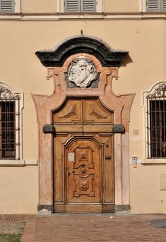 monumental portal of monastery in parma city center, shot in sunny wheater
