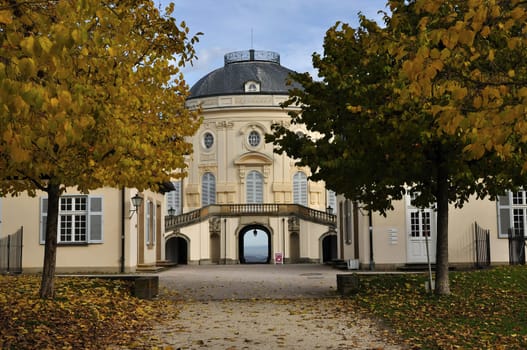 autumn foresight from the garden alley of the famous castle located in a park in surroundings of the city