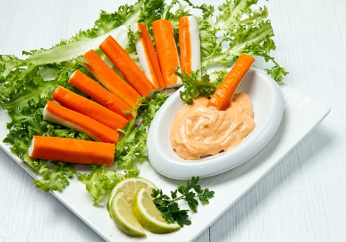 crab salad with fresh lettuce and cocktail sauce