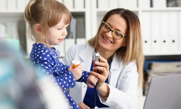 Little child with stethoscope at doctor reception. Physical exam cute infant portrait baby aid healthy lifestyle ward round child sickness specialist clinic test pulse concept