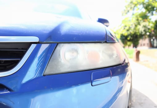 Muddy headlight on the front of the car requiring polishing sandblast all the cases for processing and studio