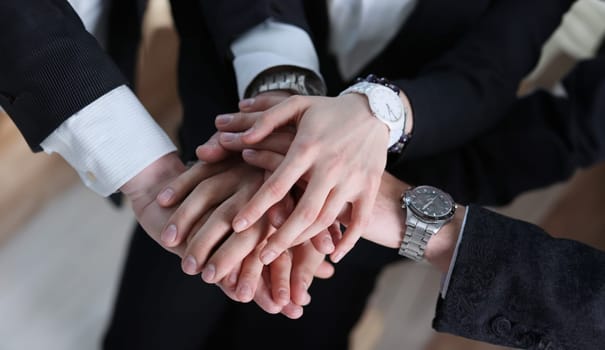 business partneers putting hands one on one concept