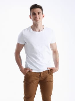 Young successful businessman on a white background in a shirt
