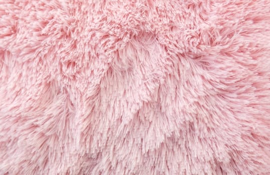 Pink texture of long wool close-up carpet. background. fluffy fur for designers, close-up.