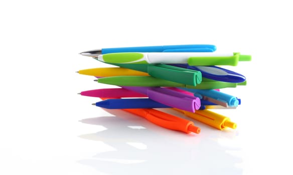 Multicolored ball point pens isolated on white background