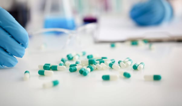 Tablets scattered on the table of the pharmaceutical laboratory pill for the prescription and treatment of various diseases chemistry